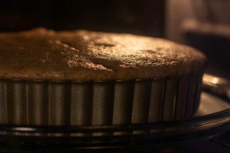 A cake baking in the oven